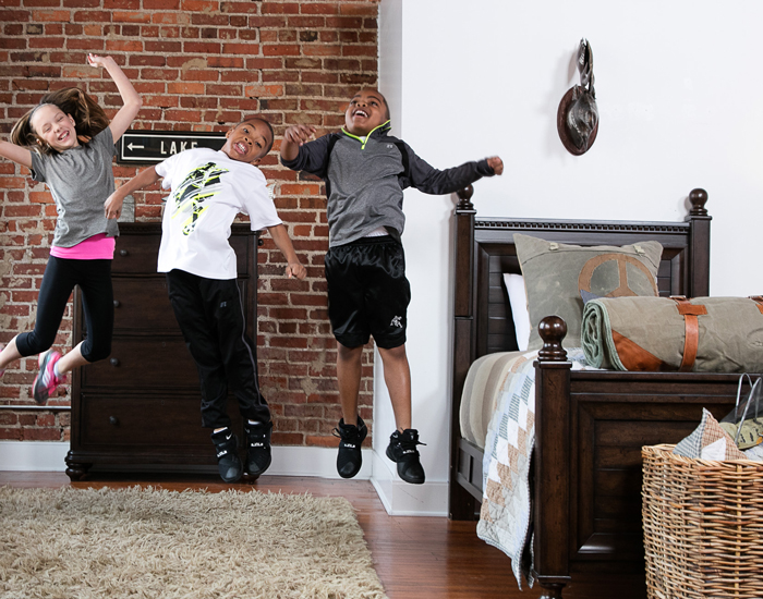 Kids jumping in bedroom